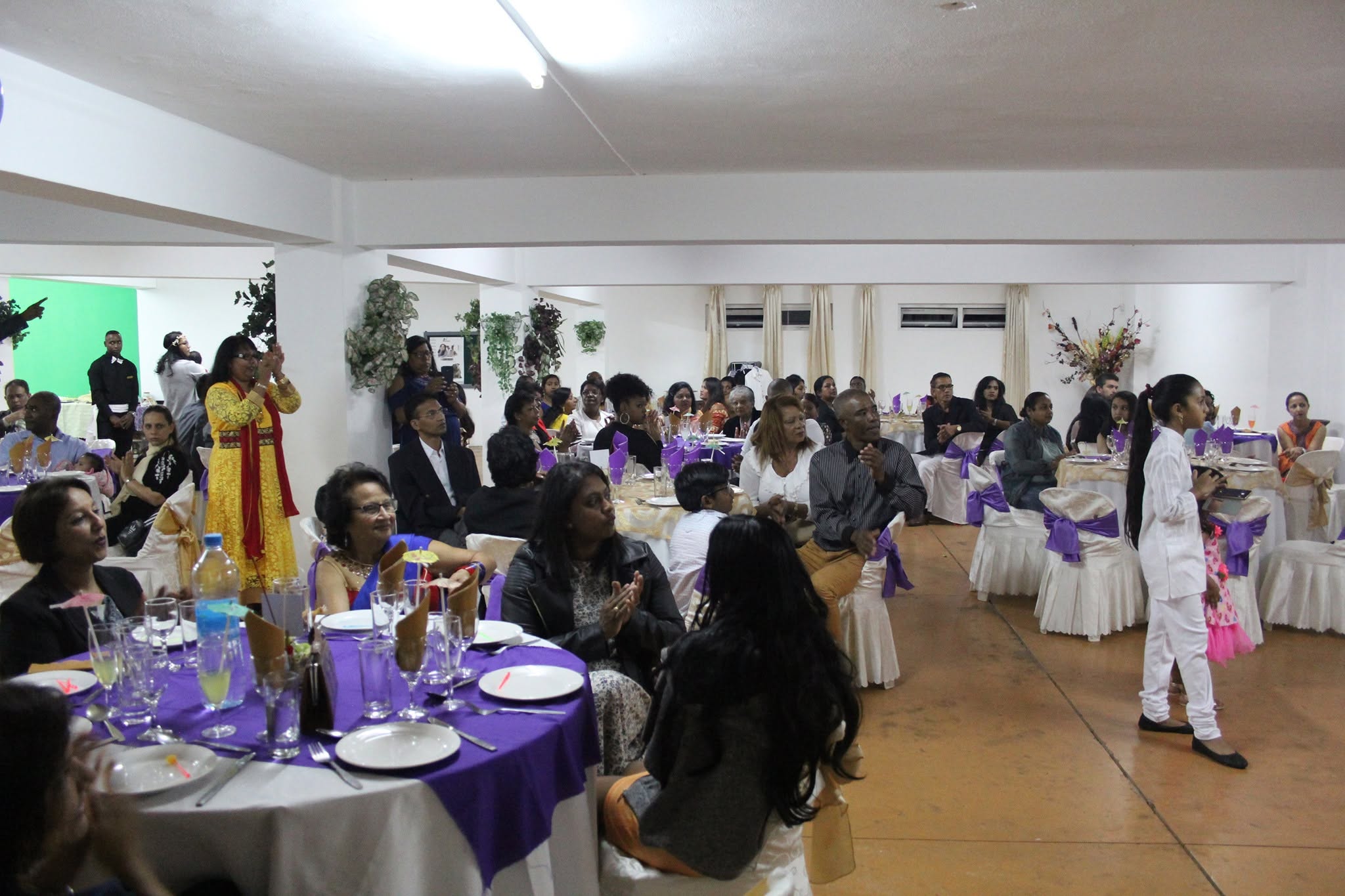 The New Sanctuary Church family sharing a celebration meal